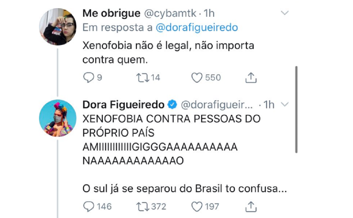 Imagem: Dora Figueiredo responde ao tweet de uma internauta que a acusou de xenofobia criticando a acusação de xenofobia dentro do próprio país (Reprodução/Twitter)